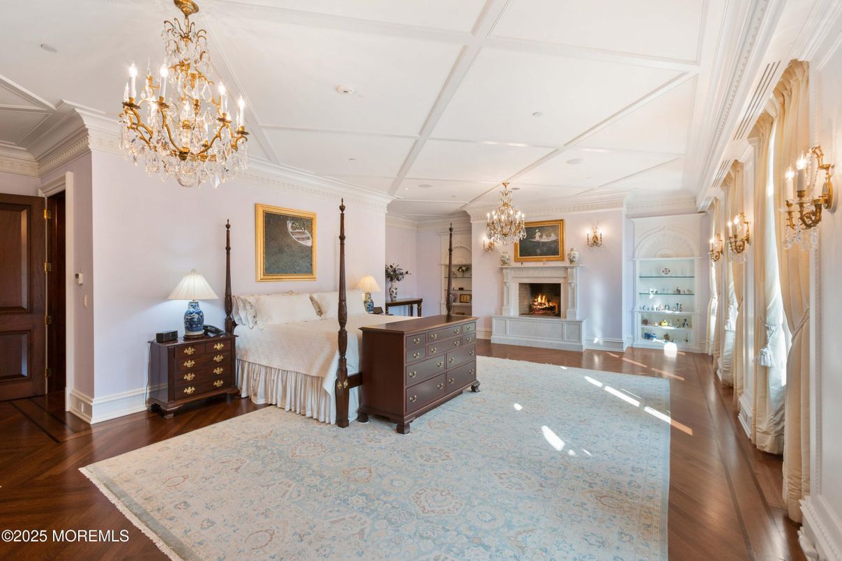 Bedroom, Chandelier, Fireplace, Interior, Recessed Lighting, Wood Texture Flooring