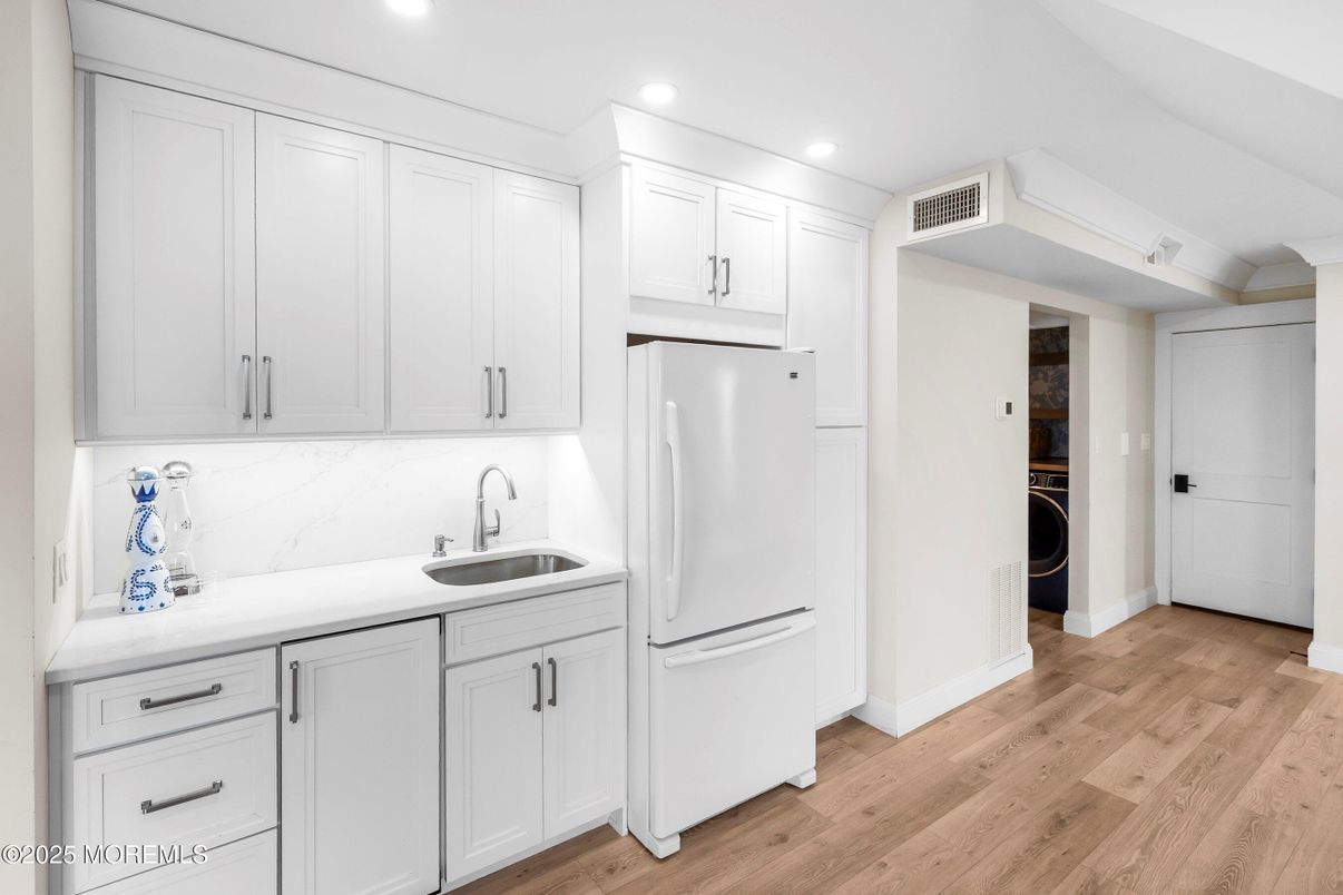 Interior, Kitchen, Recessed Lighting, Washer, Wood Texture Flooring
