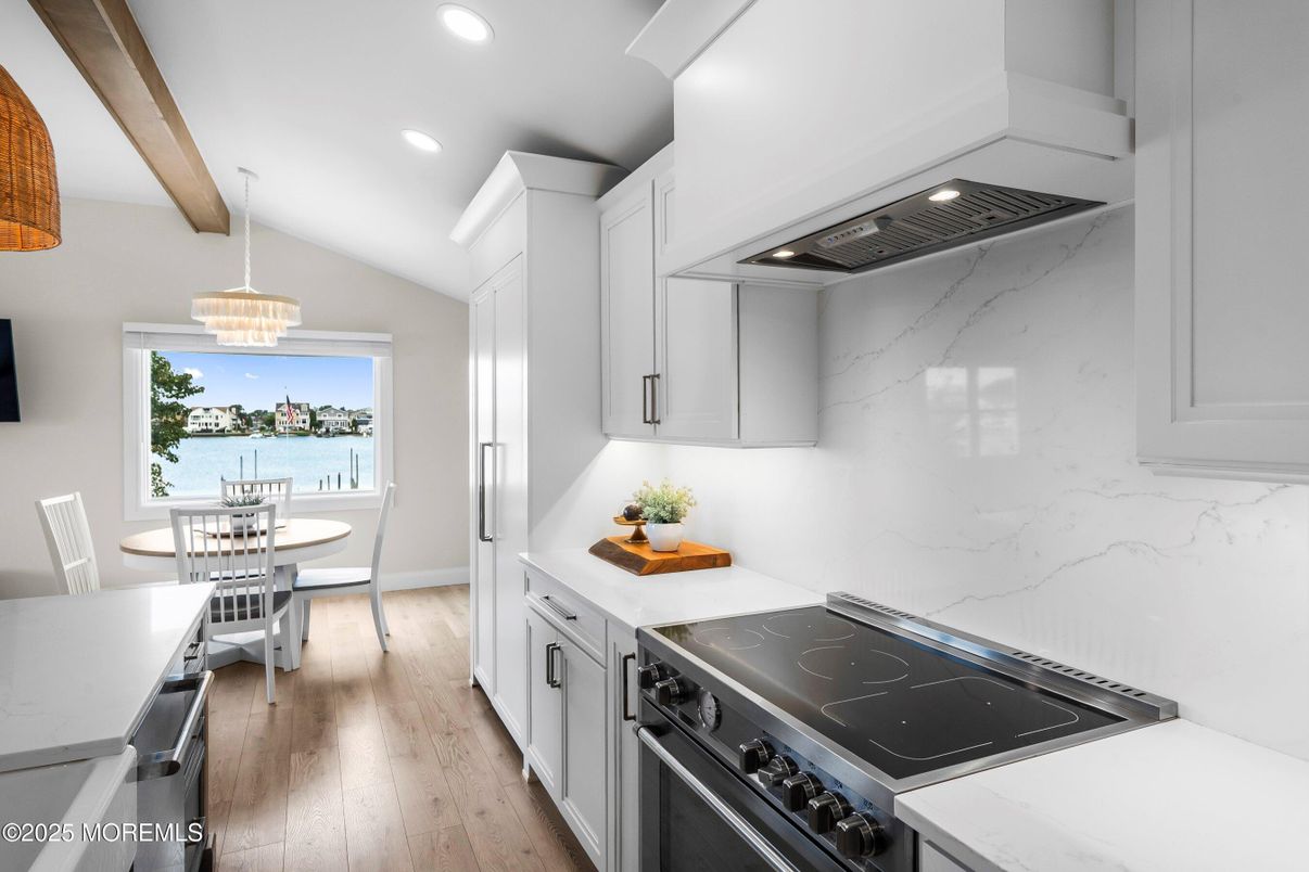 Dining room, Interior, Kitchen, Pendant Lights, Recessed Lighting, Stainless Steel Appliances, Water, Wooden Beams, Wood Texture Flooring