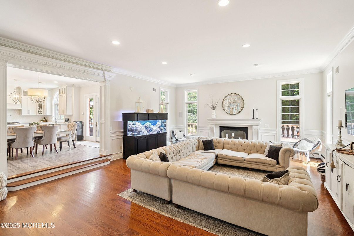 Dining room, Fireplace, Interior, Living room, Pendant Lights, Recessed Lighting, Wood Texture Flooring