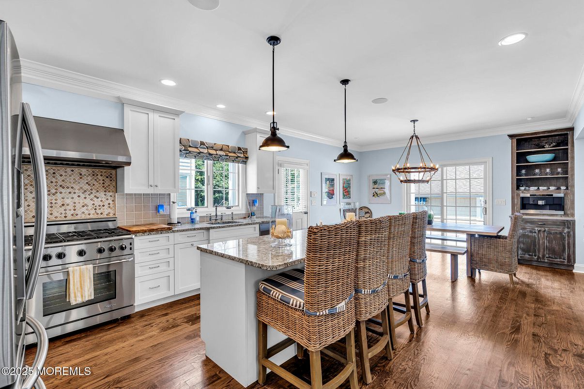 Dining room, Interior, Kitchen, Pendant Lights, Recessed Lighting, Stainless Steel Appliances, Wood Texture Flooring