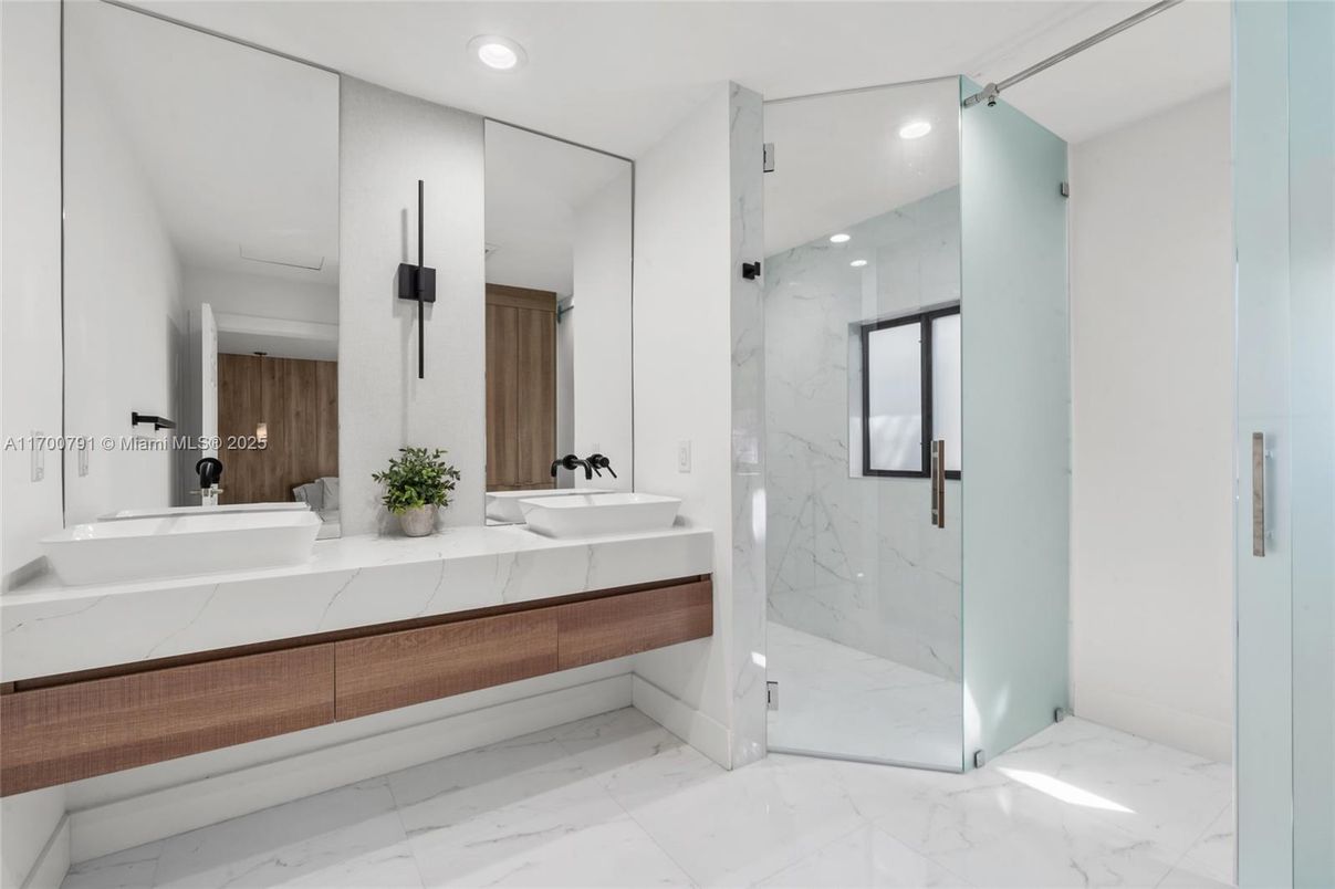 Bathroom, Dual Sink Vanities, Glass Shower, Interior, Marble, Marble Walls, Recessed Lighting
