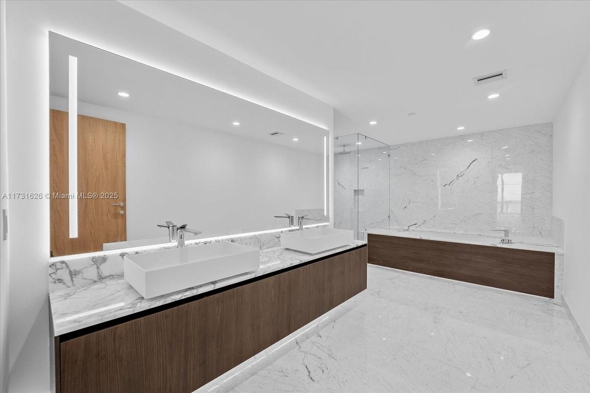 Bathroom, Dual Sink Vanities, Glass Shower, Interior, Marble, Marble Walls, Recessed Lighting