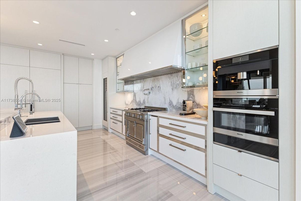 Interior, Kitchen, Marble Walls, Recessed Lighting, Stainless Steel Appliances