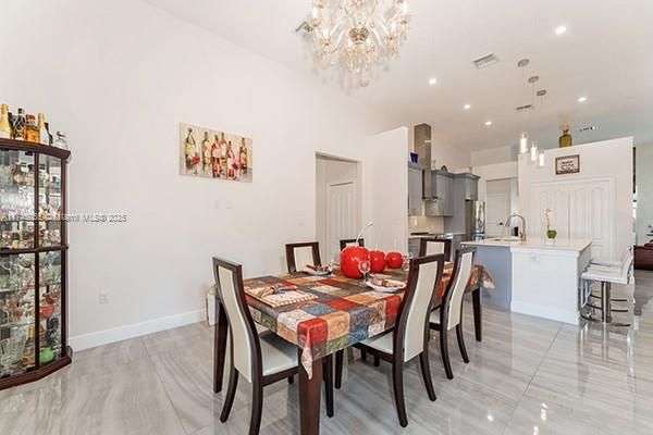 Chandelier, Dining room, Interior, Kitchen, Pendant Lights, Recessed Lighting, Stainless Steel Appliances
