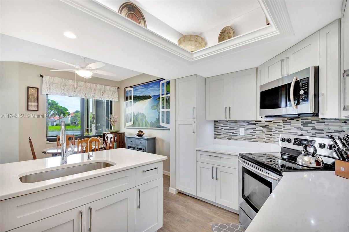 Dining room, Interior, Kitchen, Recessed Lighting, Stainless Steel Appliances, Wood Texture Flooring
