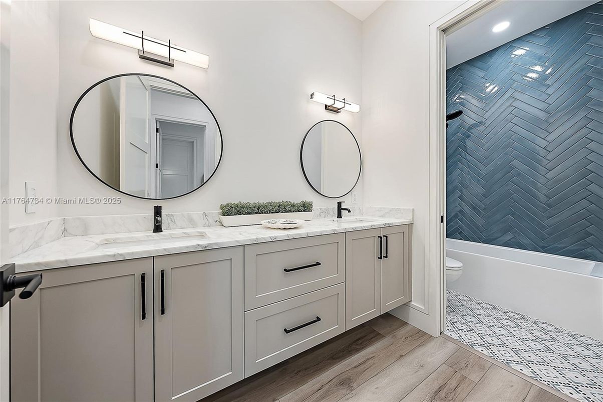 Bathroom, Dual Sink Vanities, Interior, Recessed Lighting, Wood Texture Flooring