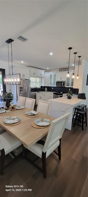 Dining room, Interior, Kitchen, Pendant Lights, Recessed Lighting, Stainless Steel Appliances, Wood Texture Flooring