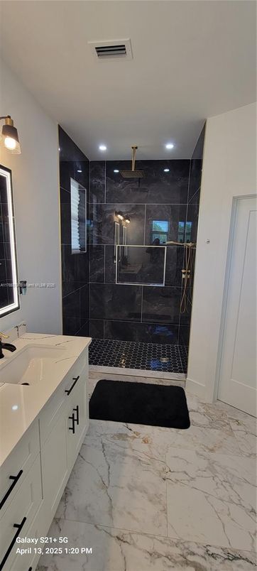 Bathroom, Dual Sink Vanities, Glass Shower, Interior, Marble, Marble Walls, Recessed Lighting
