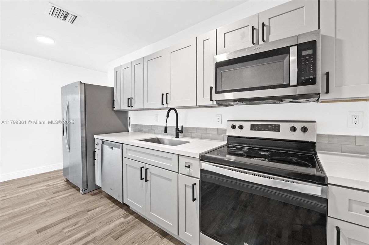 Interior, Kitchen, Recessed Lighting, Stainless Steel Appliances, Wood Texture Flooring