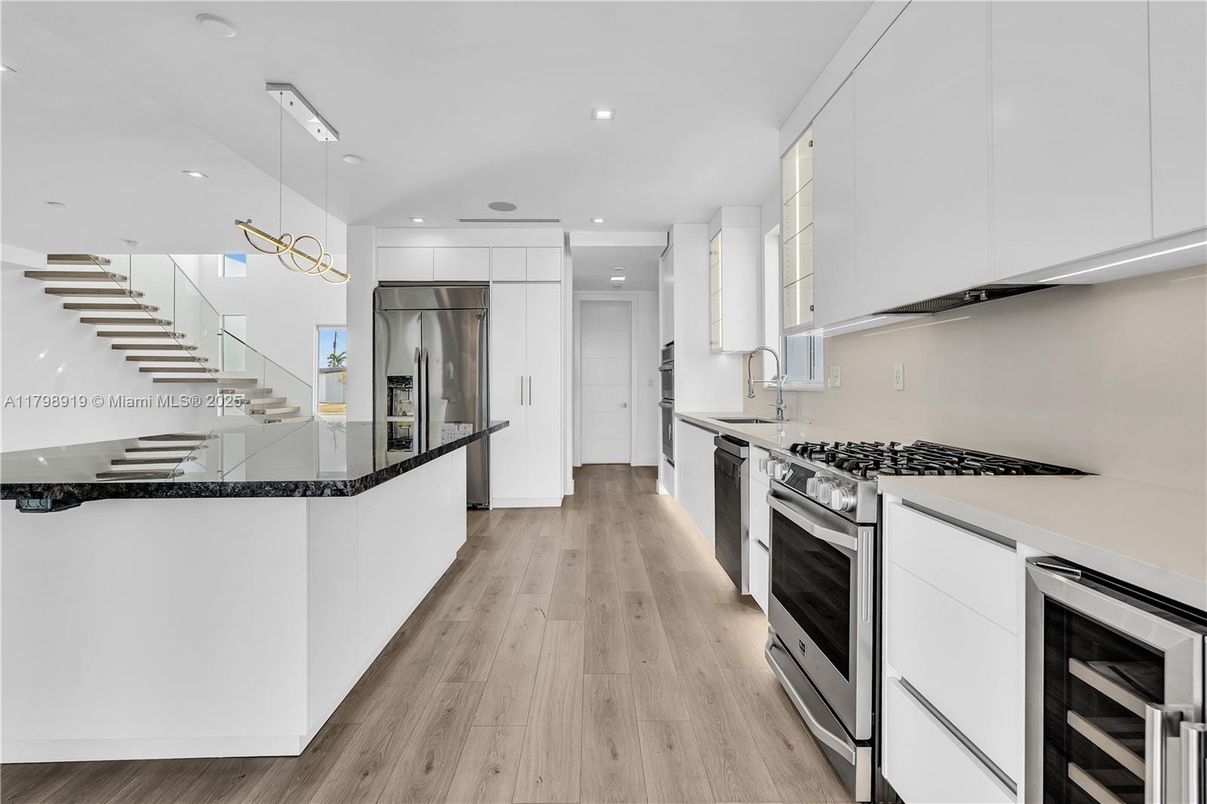 Interior, Kitchen, Pendant Lights, Recessed Lighting, Stainless Steel Appliances, Wood Texture Flooring