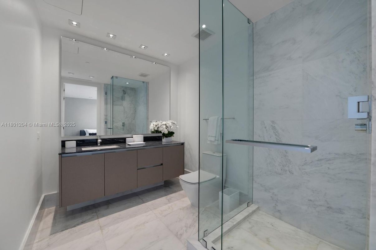 Bathroom, Dual Sink Vanities, Glass Shower, Interior, Marble, Marble Walls, Recessed Lighting