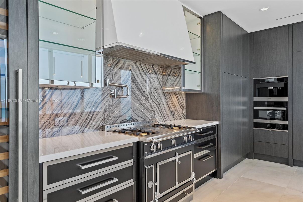 Interior, Kitchen, Marble Walls, Recessed Lighting, Stainless Steel Appliances