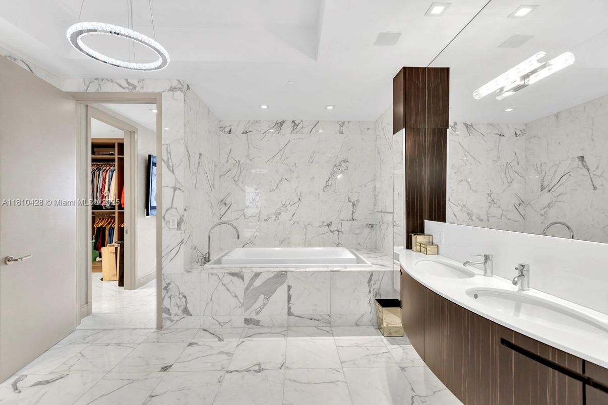 Bathroom, Dual Sink Vanities, Interior, Marble, Marble Walls, Pendant Lights, Recessed Lighting