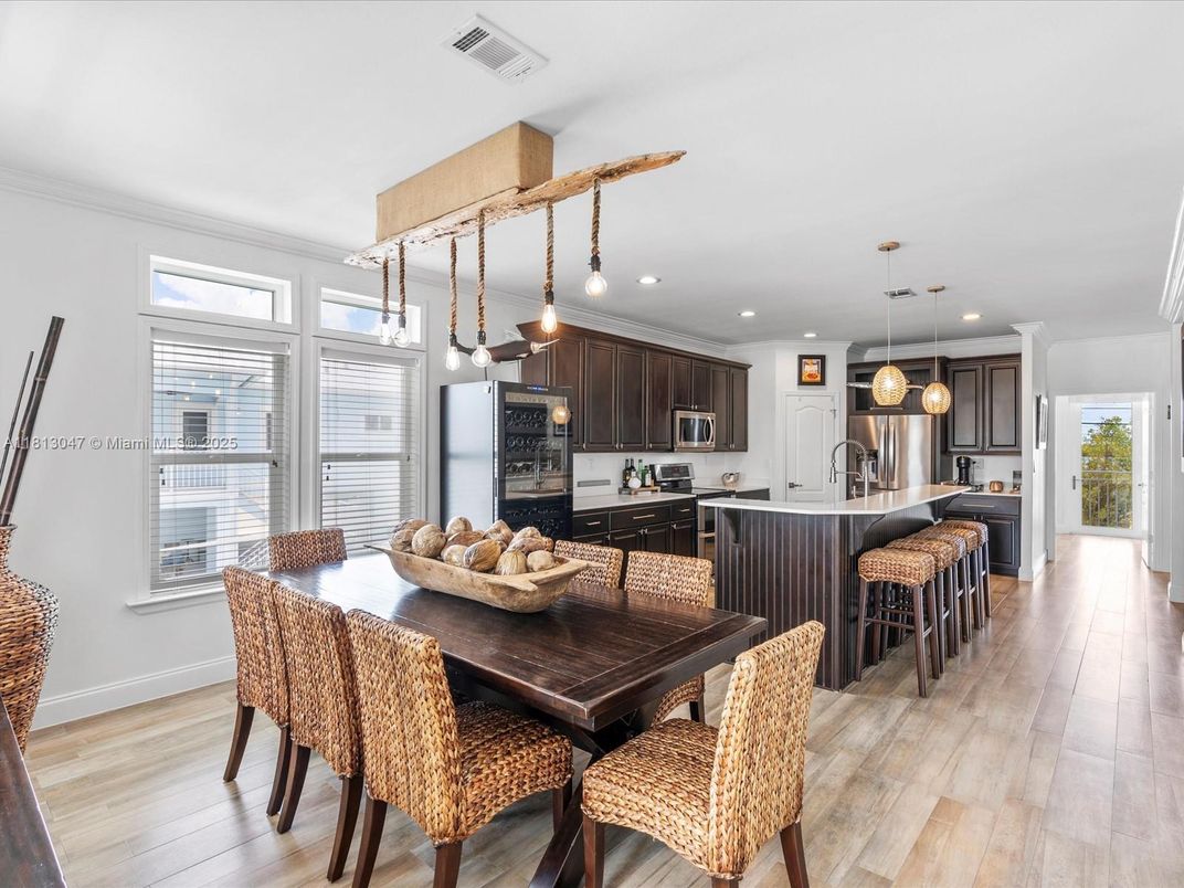 Dining room, Interior, Kitchen, Pendant Lights, Recessed Lighting, Stainless Steel Appliances, Wood Texture Flooring
