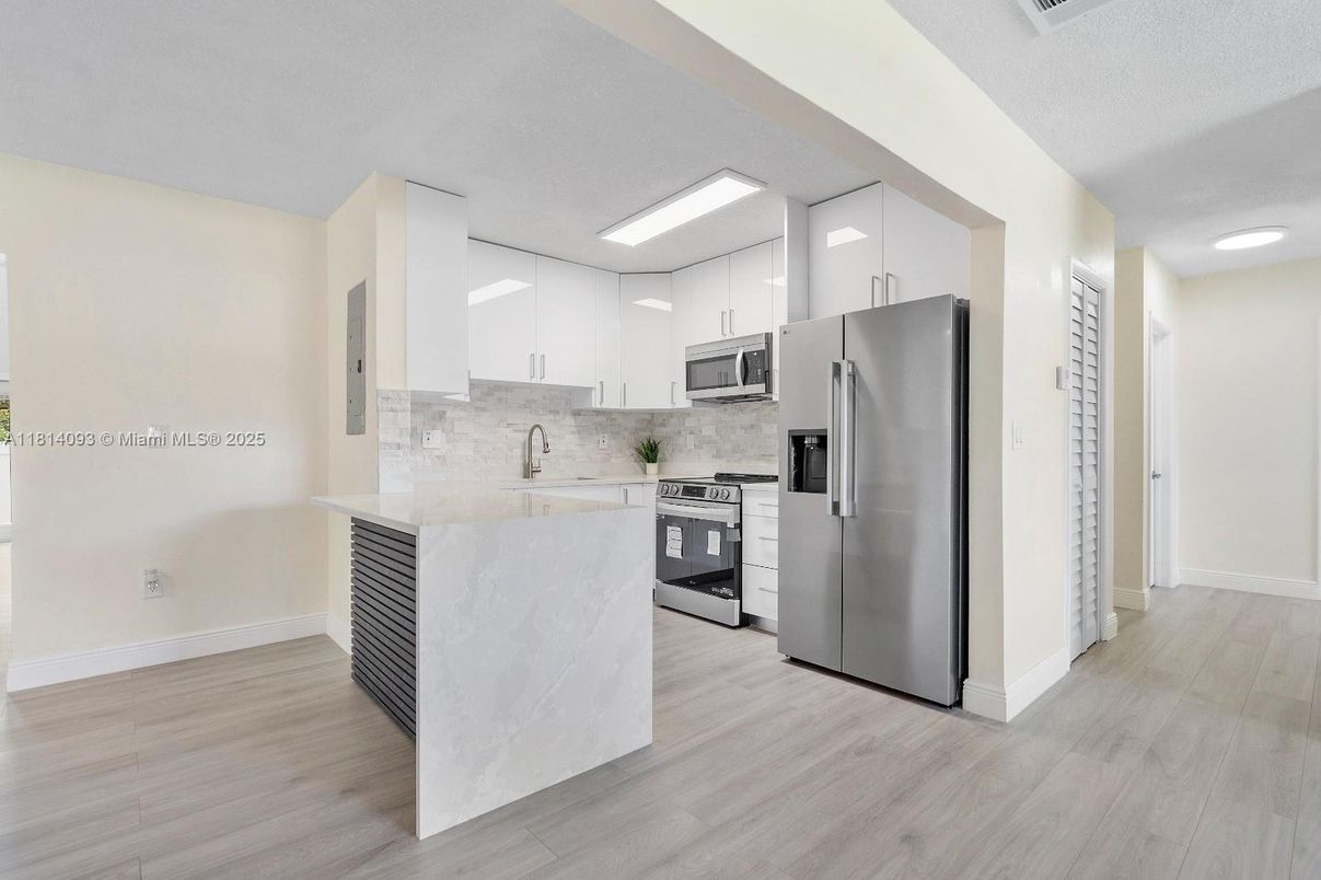 Interior, Kitchen, Recessed Lighting, Stainless Steel Appliances, Wood Texture Flooring