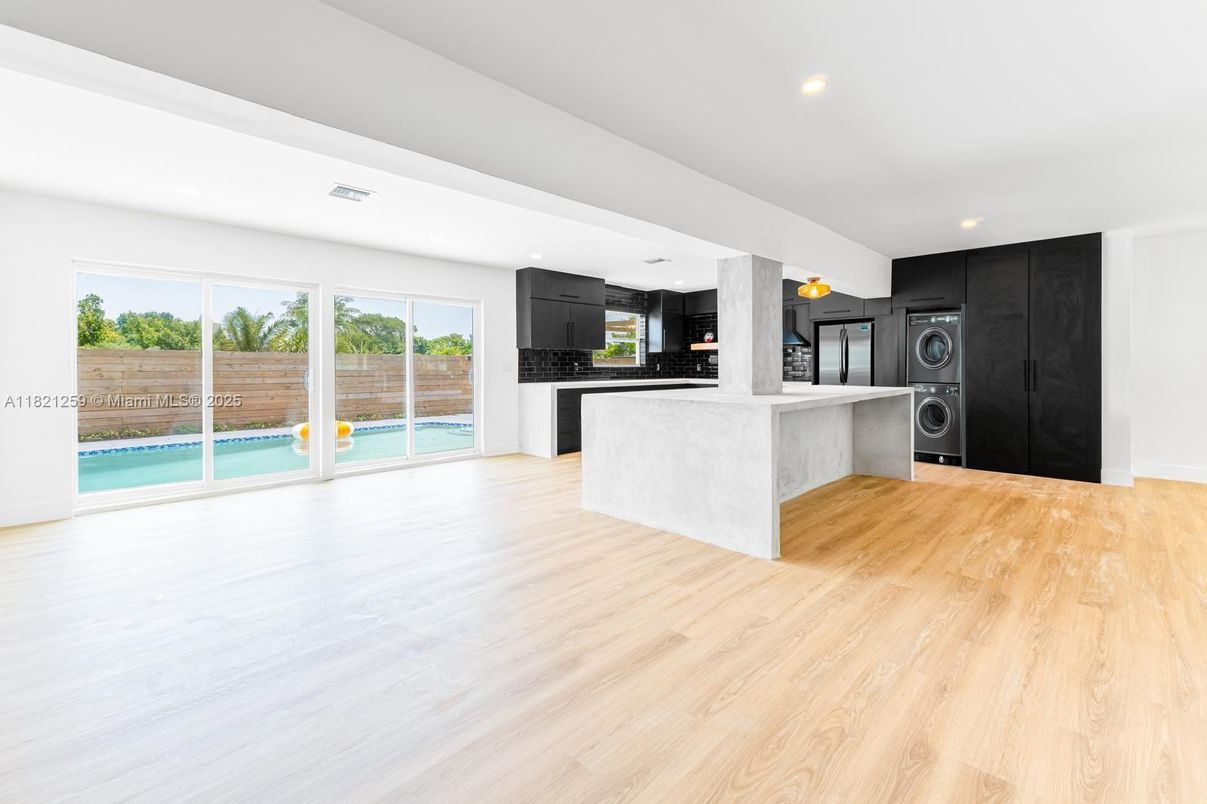 Interior, Kitchen, Recessed Lighting, Washer, Wood Texture Flooring