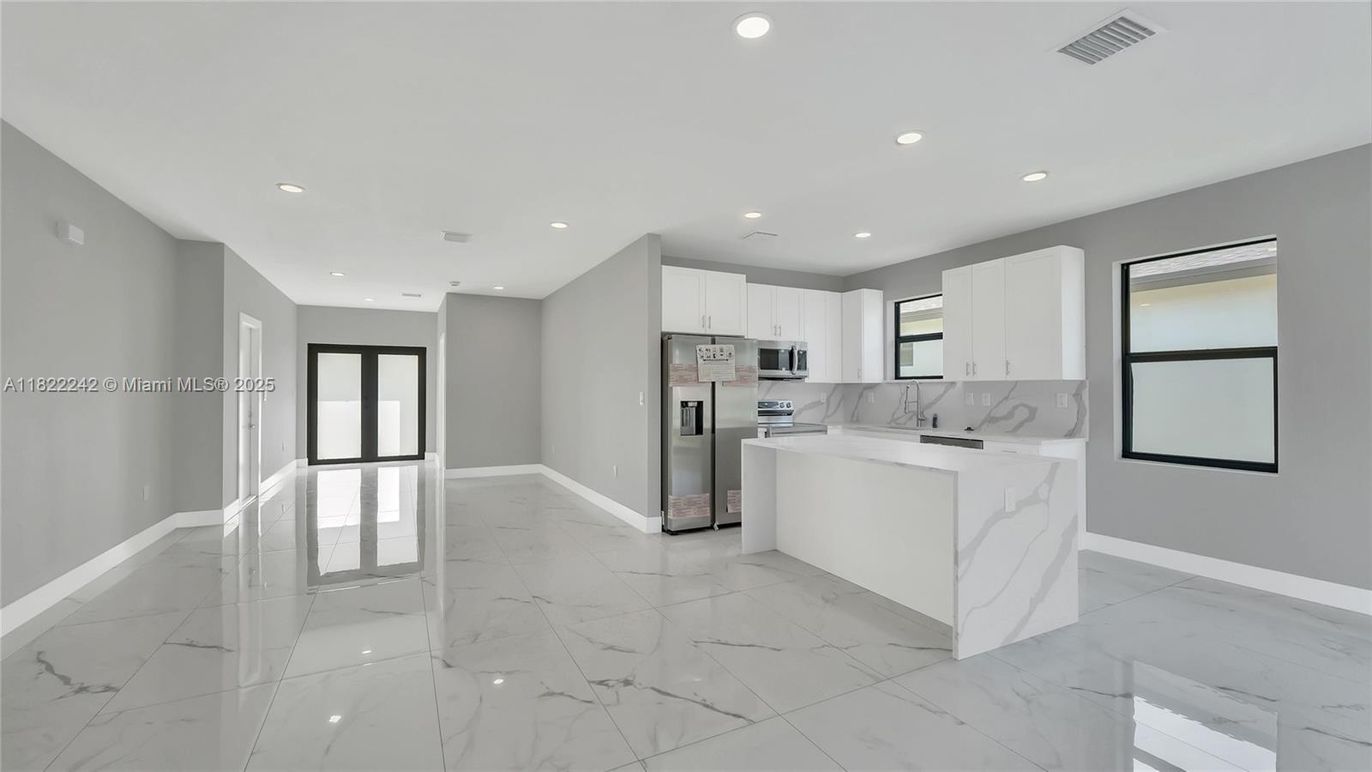 Interior, Kitchen, Marble, Marble Walls, Recessed Lighting, Stainless Steel Appliances
