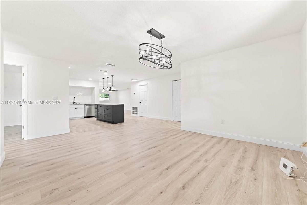 Chandelier, Empty room, Interior, Kitchen, Pendant Lights, Recessed Lighting, Wood Texture Flooring