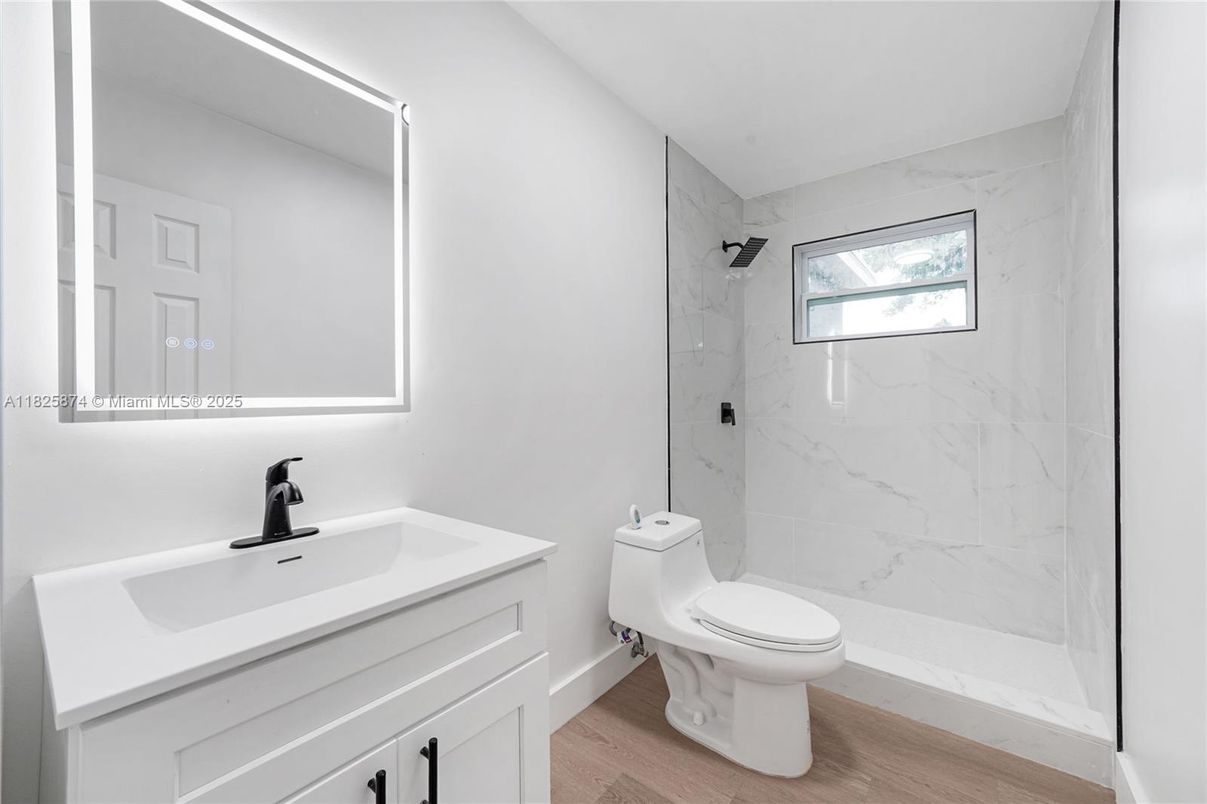 Bathroom, Glass Shower, Interior, Marble Walls, Wood Texture Flooring