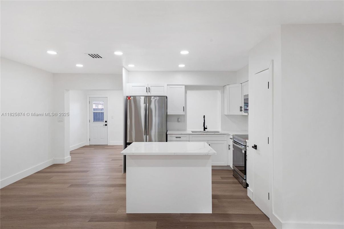 Interior, Kitchen, Recessed Lighting, Stainless Steel Appliances, Wood Texture Flooring
