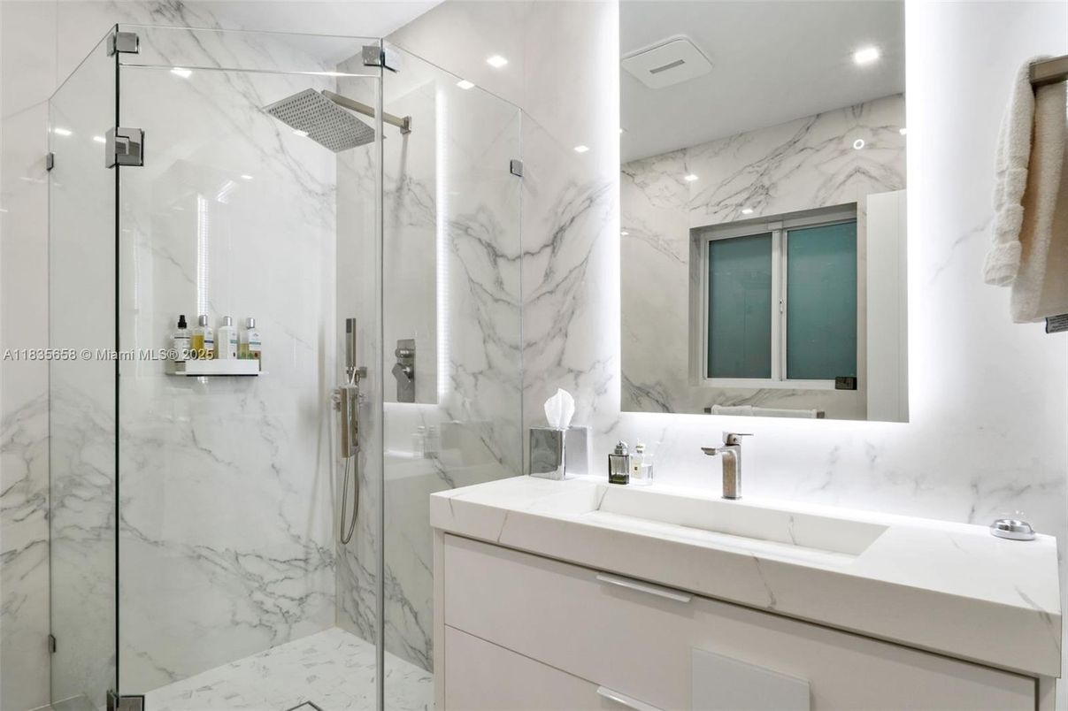 Bathroom, Dual Sink Vanities, Glass Shower, Interior, Marble Walls, Recessed Lighting