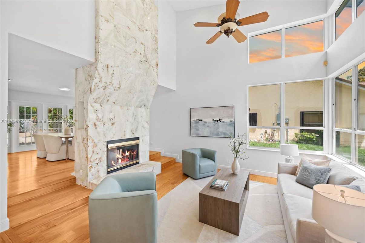 Fireplace, Interior, Living room, Marble Walls, Recessed Lighting, Stone Walls, Wood Texture Flooring