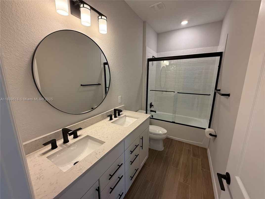 Bathroom, Dual Sink Vanities, Glass Shower, Interior, Recessed Lighting, Wood Texture Flooring