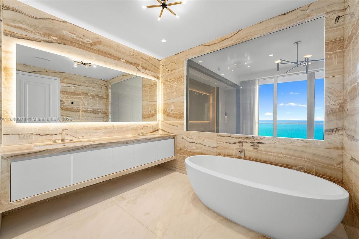 Bathroom, Dual Sink Vanities, Free Standing Baths, Interior, Marble Walls, Recessed Lighting, Water
