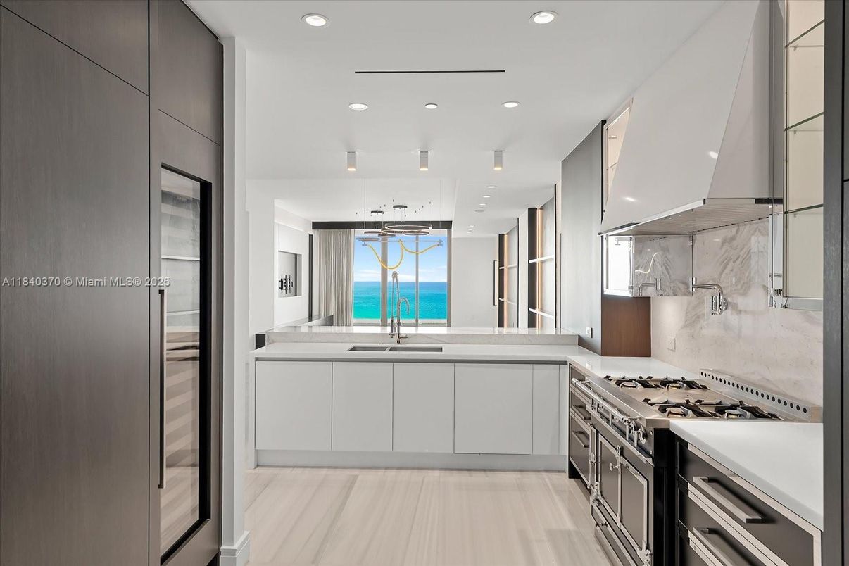 Interior, Kitchen, Marble Walls, Pendant Lights, Recessed Lighting, Stainless Steel Appliances, Water