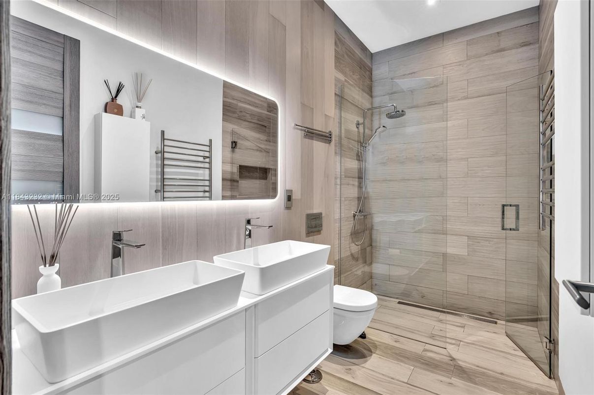 Bathroom, Dual Sink Vanities, Free Standing Baths, Glass Shower, Interior, Recessed Lighting, Wood Texture Flooring