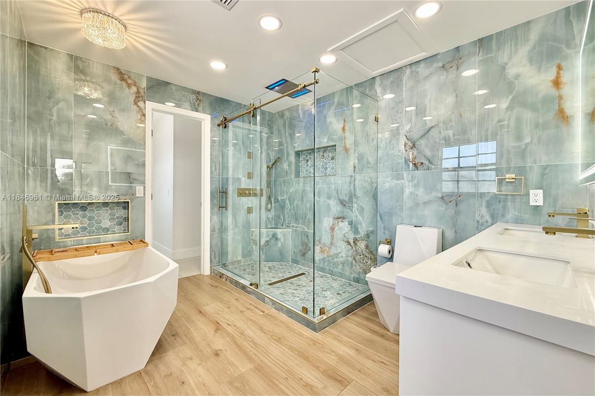 Bathroom, Free Standing Baths, Glass Shower, Interior, Recessed Lighting, Wood Texture Flooring