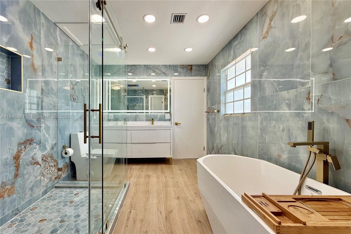 Bathroom, Free Standing Baths, Glass Shower, Interior, Recessed Lighting, Wood Texture Flooring