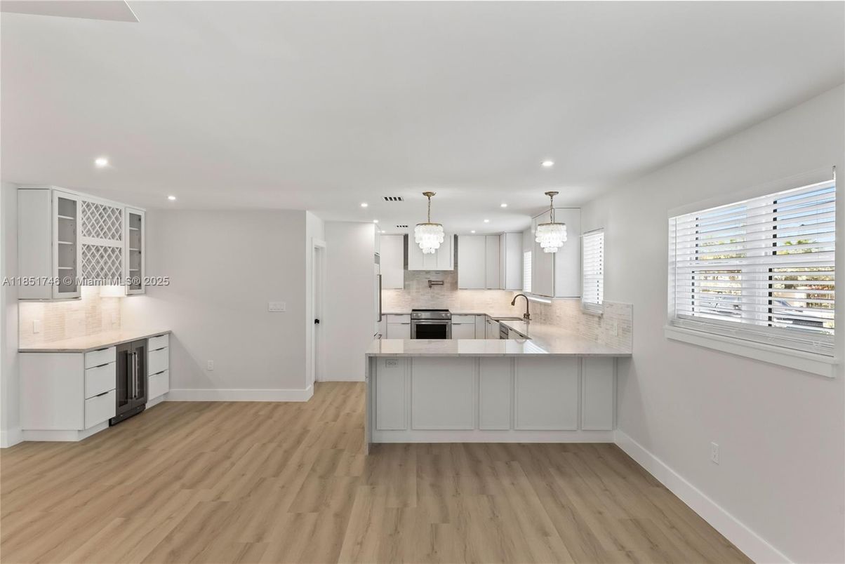 Chandelier, Interior, Kitchen, Pendant Lights, Recessed Lighting, Stainless Steel Appliances, Wood Texture Flooring
