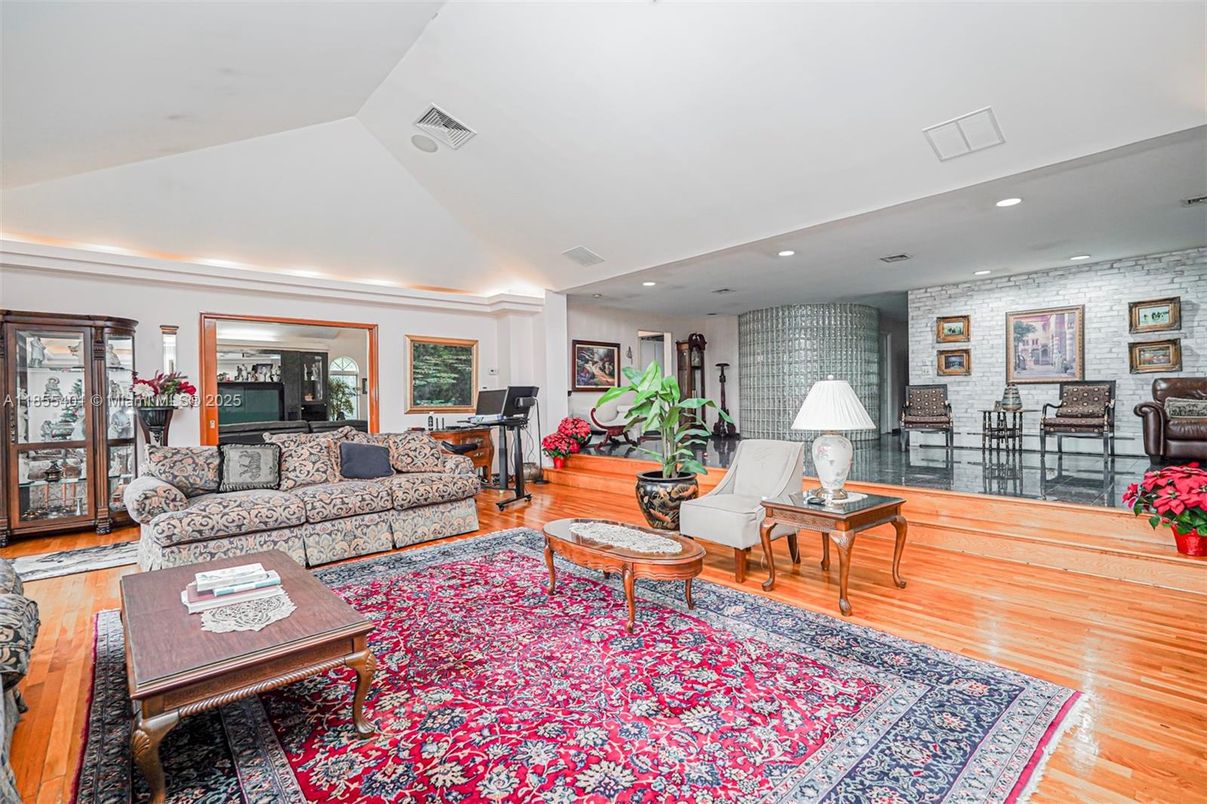 Fitness Equipment, Interior, Living room, Piano, Recessed Lighting, Stone Walls, Wood Texture Flooring