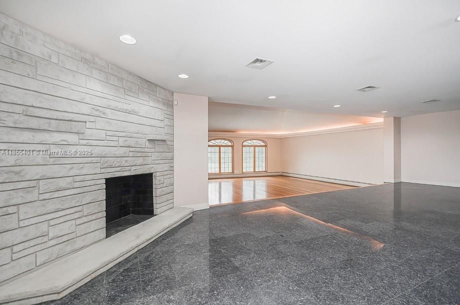 Empty room, Fireplace, Interior, Recessed Lighting, Stone Walls, Wood Texture Flooring
