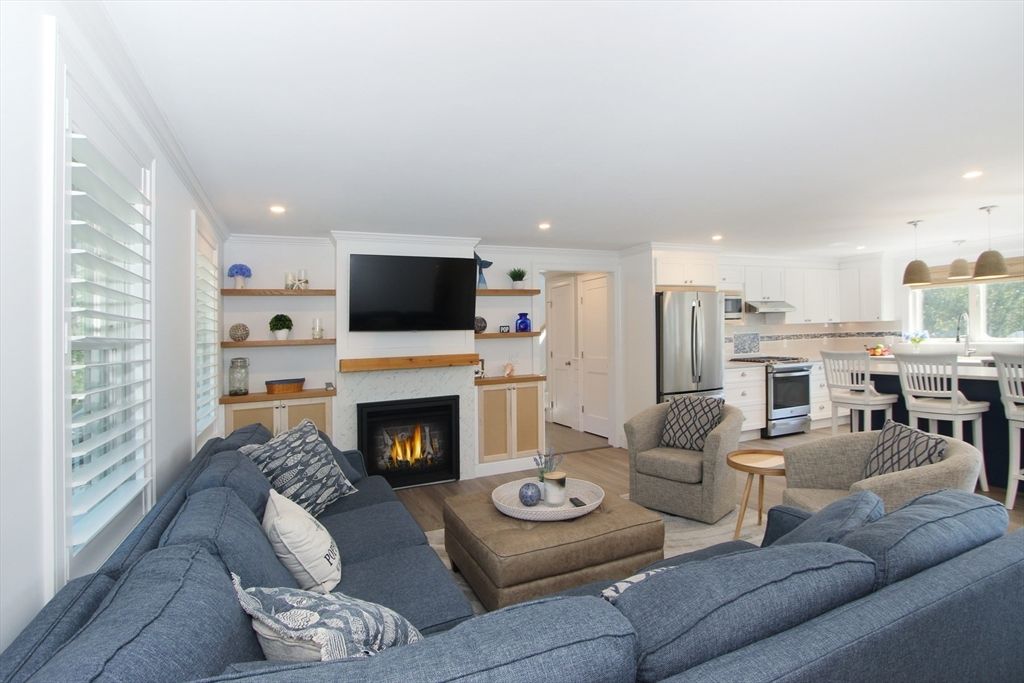 Dining room, Fireplace, Interior, Kitchen, Living room, Pendant Lights, Recessed Lighting, Stainless Steel Appliances, Wood Texture Flooring