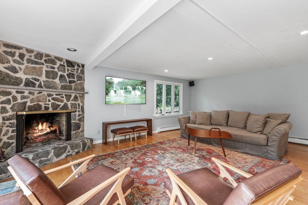 Fireplace, Interior, Living room, Recessed Lighting, Stone Walls, Wood Texture Flooring