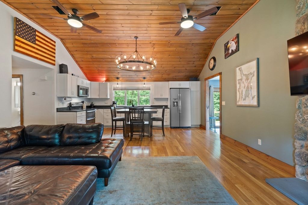 Chandelier, Dining room, Interior, Kitchen, Living room, Pendant Lights, Stainless Steel Appliances, Wooden Ceilings, Wood Texture Flooring