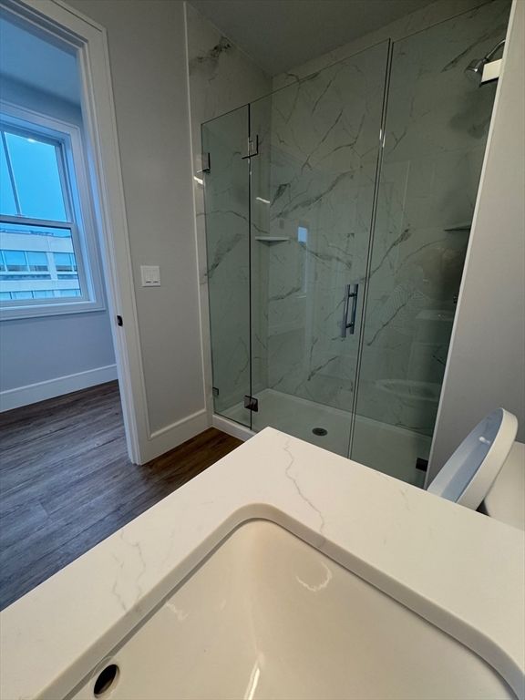 Bathroom, Glass Shower, Interior, Marble Walls, Wood Texture Flooring