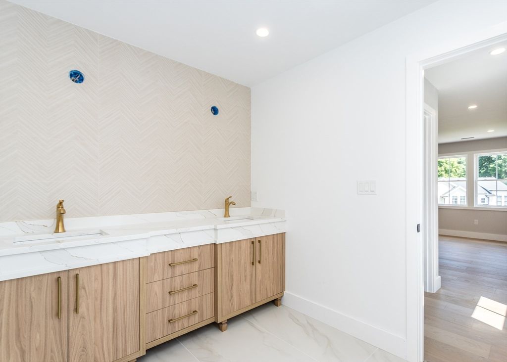 Bathroom, Dual Sink Vanities, Interior, Marble, Recessed Lighting, Wood Texture Flooring