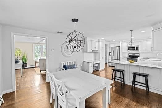 Chandelier, Dining room, Interior, Kitchen, Pendant Lights, Recessed Lighting, Stainless Steel Appliances, Wood Texture Flooring