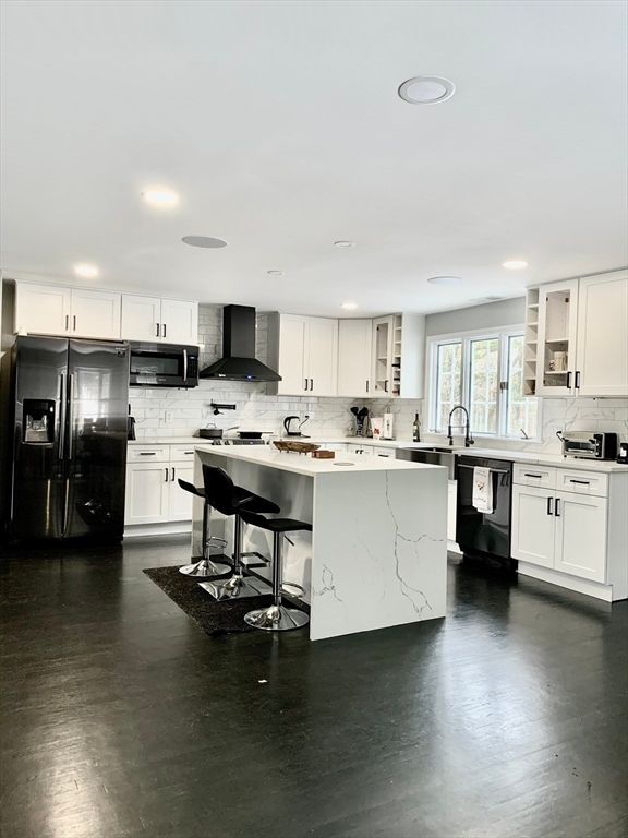 Interior, Kitchen, Marble Walls, Recessed Lighting, Stainless Steel Appliances, Wood Texture Flooring