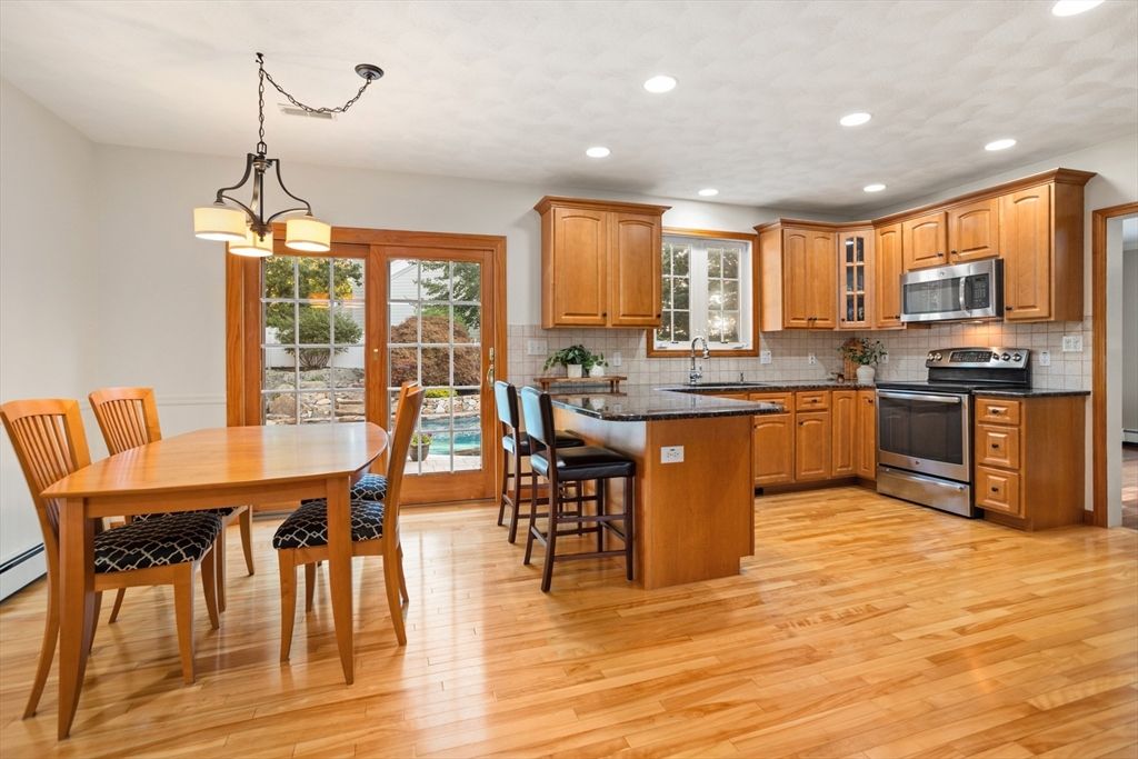 Chandelier, Dining room, Interior, Kitchen, Pendant Lights, Recessed Lighting, Stainless Steel Appliances, Wood Texture Flooring