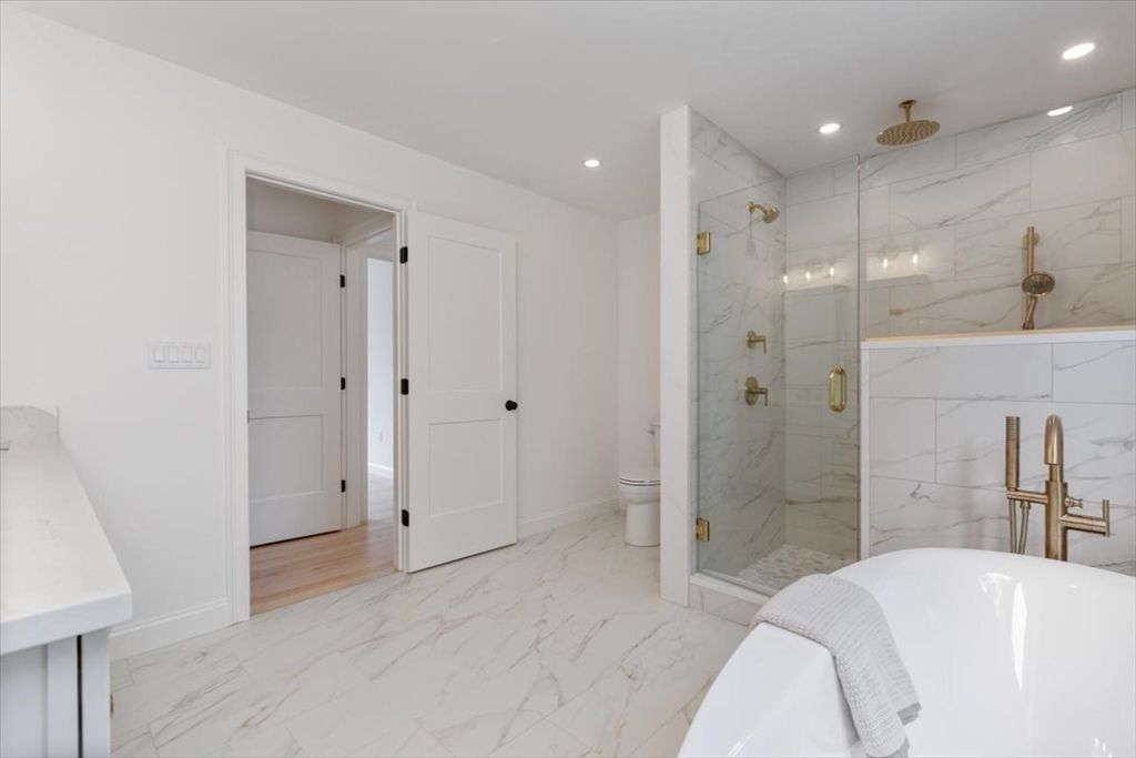 Bathroom, Glass Shower, Interior, Marble, Marble Walls, Recessed Lighting, Wood Texture Flooring