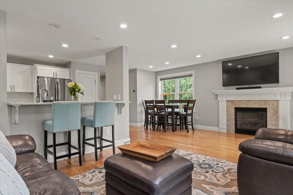 Dining room, Fireplace, Interior, Kitchen, Recessed Lighting, Stainless Steel Appliances, Wood Texture Flooring