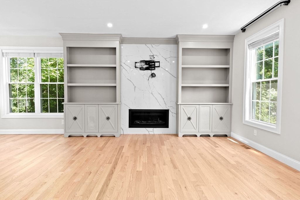 Fireplace, Interior, Marble Walls, Recessed Lighting, Wood Texture Flooring