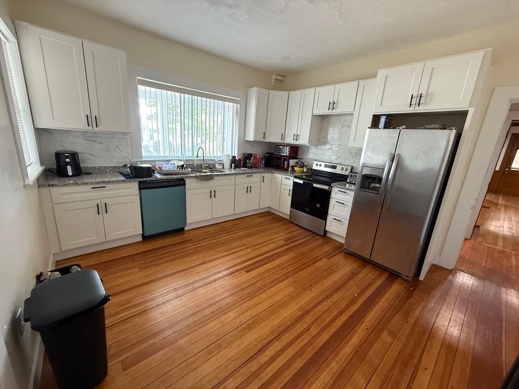Interior, Kitchen, Marble Walls, Stainless Steel Appliances, Wood Texture Flooring