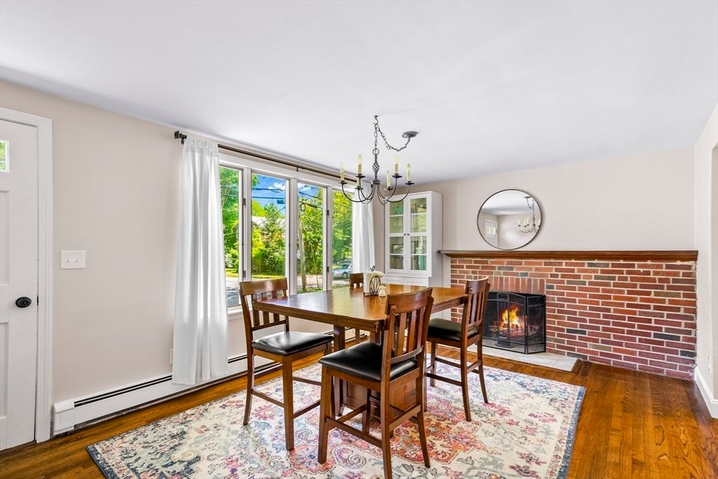 Chandelier, Dining room, Fireplace, Interior, Stone Walls, Wood Texture Flooring