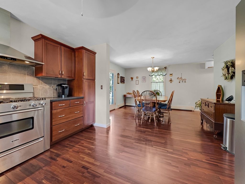 Chandelier, Dining room, Interior, Kitchen, Stainless Steel Appliances, Wood Texture Flooring